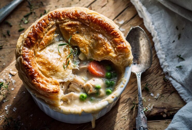 Top-down view of a freshly baked homemade chicken pot pie kentucky fried style with a flaky golden crust.